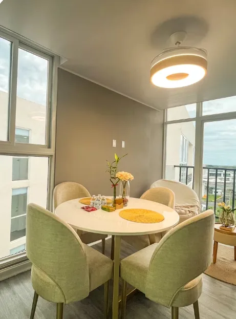 Dining table with 4 chairs in natural light, apartment near Tocumen Airport