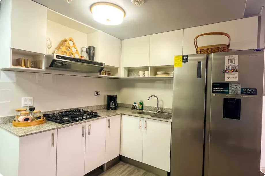 Modern fully equipped kitchen with stainless fridge near Tocumen Airport Panama